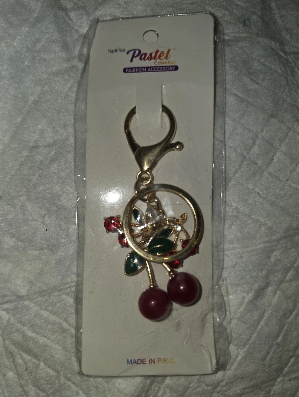 Gold-tone Cherry Keychain with Red Accents